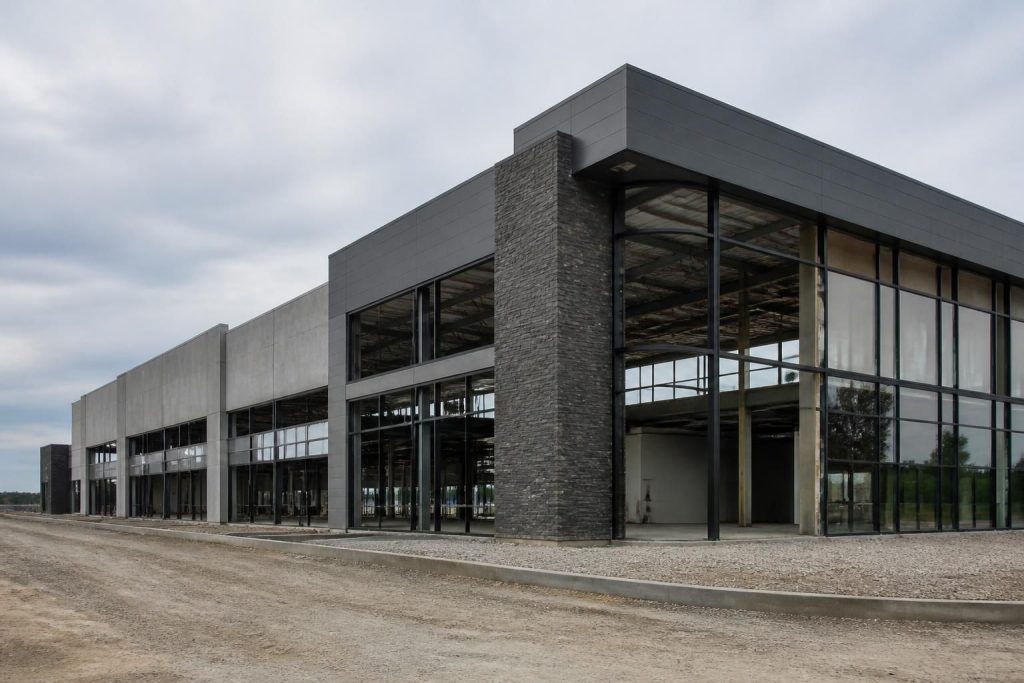 Modern commercial building exterior under construction with clean structural lines.
